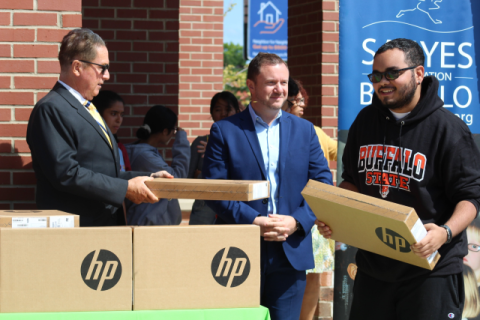 Rep. Brian Higgins (NY-26) handing out laptops to college students in East Buffalo, NY.