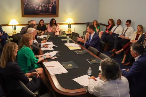 Secretary Pete Buttigieg and RLC Members talking RLC headquarters