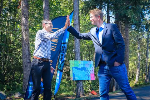 Rep. Derek Kilmer high-fiving a local leader in the city of Bainbridge Island.