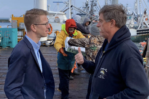 Kilmer and Worker talk by a dock